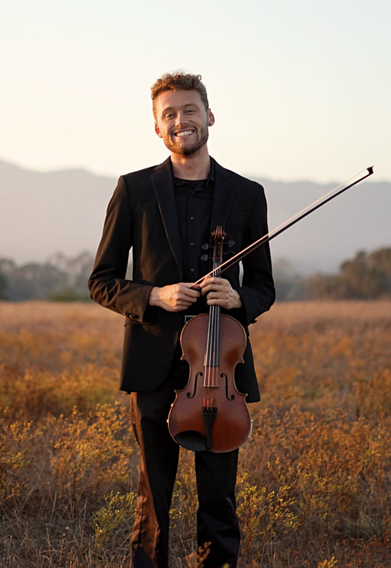 Cam Audras holding a viola